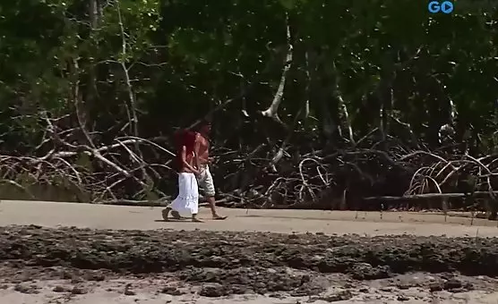 RedHeaded Blows Man on Sand Dunes
